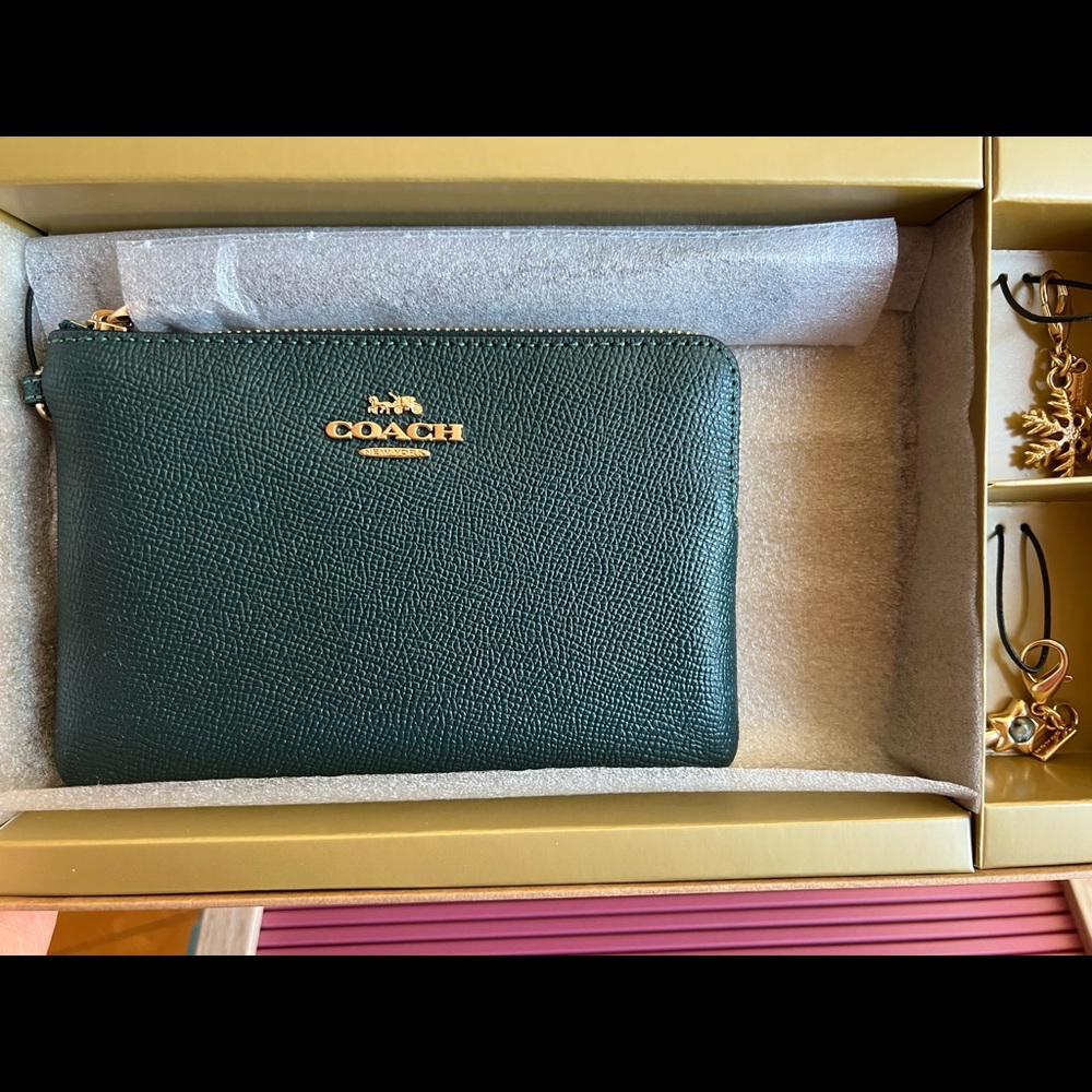 Boxed Coach Wristlet with charms